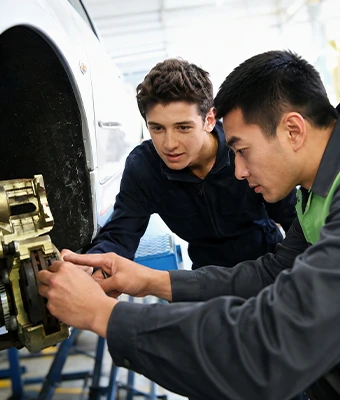 Engineer Explaining Equipment To Customer
